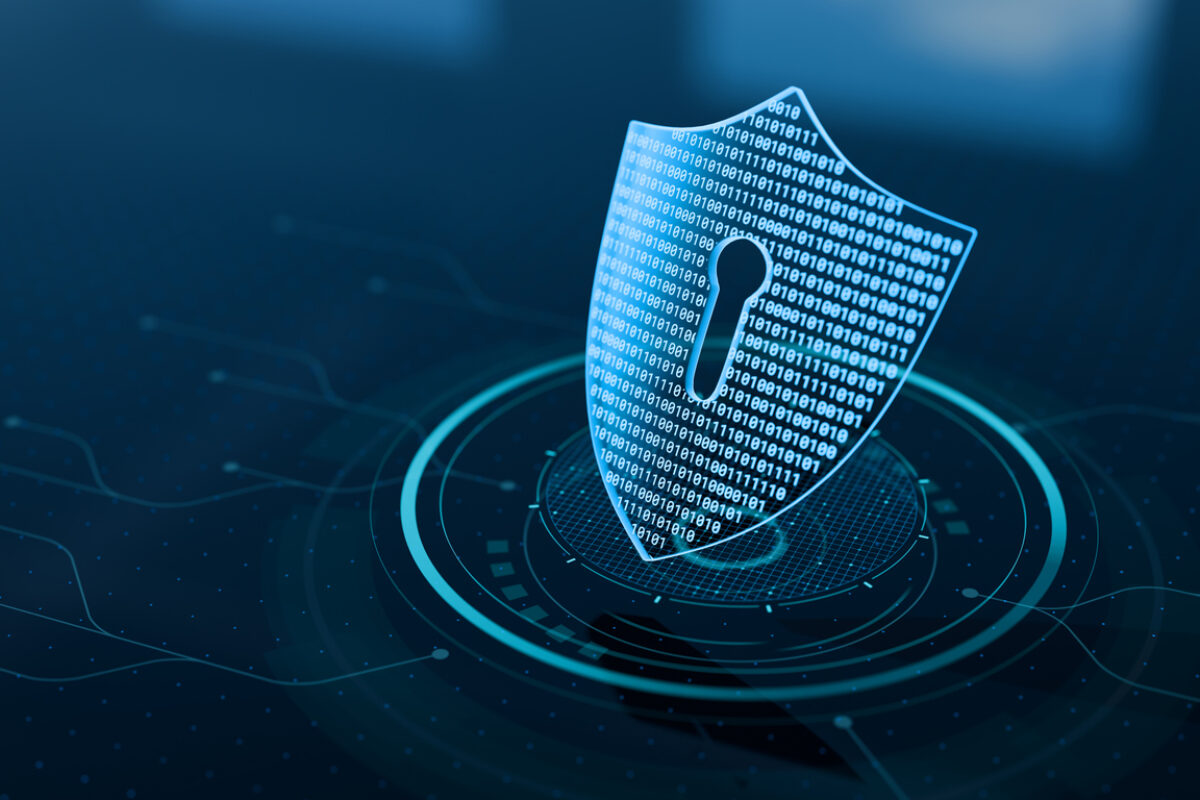 a digital shield to represent a secure digital infrastructure. The shield is blue on a black background